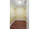 An empty walk-in closet with a wood floor, white wire shelving, and plenty of storage space at 8800 Dorchester Rd # 4001, North Charleston, SC 29420