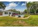 Expansive backyard showcasing a swimming pool, lush greenery, and well-maintained landscaping at 902 Mikell Dr, Charleston, SC 29412