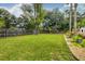 Large, well-maintained backyard featuring a playground and lush green grass, ideal for outdoor activities at 902 Mikell Dr, Charleston, SC 29412