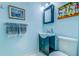 Stylish bathroom with blue walls, sink and vanity with art decorations at 902 Mikell Dr, Charleston, SC 29412