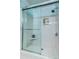 Bathroom with white subway tile and sliding glass door at 902 Mikell Dr, Charleston, SC 29412
