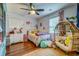Charming bedroom features wood floors and cozy decor at 902 Mikell Dr, Charleston, SC 29412