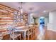 Dining room featuring a distressed wood accent wall with a view into other rooms at 902 Mikell Dr, Charleston, SC 29412