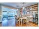 Dining room featuring a distressed wood accent wall and adjacent living area at 902 Mikell Dr, Charleston, SC 29412