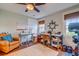 Well-lit home office with hardwood floors, a comfortable seating area, and practical workspace at 902 Mikell Dr, Charleston, SC 29412