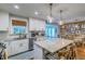 Bright kitchen with an island featuring a sink and lots of cabinet space at 902 Mikell Dr, Charleston, SC 29412