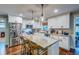 Modern kitchen with stainless steel appliances, a large center island, and ample cabinet space at 902 Mikell Dr, Charleston, SC 29412