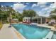 Enjoy this backyard pool with a screen room and adjacent pool house, perfect for relaxation and entertaining at 902 Mikell Dr, Charleston, SC 29412