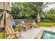 Relaxing poolside patio with comfortable seating and beautiful landscaping, perfect for enjoying sunny days at 902 Mikell Dr, Charleston, SC 29412