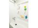 Clean bathroom with a bathtub, shower, built-in shelves, and playful aquatic themed decorations at 9887 Midview Dr, Ladson, SC 29456