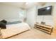 Well-lit bedroom with soft carpet, a mounted TV, and simple, streamlined furniture creating a relaxing space at 9887 Midview Dr, Ladson, SC 29456