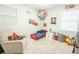 Charming ' room with 'Cars' decor, featuring bright colors, toys, and a comfortable reading chair at 9887 Midview Dr, Ladson, SC 29456
