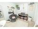 Cozy bedroom area features a comfortable chair, piano, decorative shelves, and plenty of natural light at 9887 Midview Dr, Ladson, SC 29456