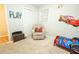 Playful ' room with 'Cars' themed decor, a comfortable chair, and a toy storage chest at 9887 Midview Dr, Ladson, SC 29456