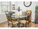 Cozy dining area featuring a round glass table and four decorative chairs at 9887 Midview Dr, Ladson, SC 29456