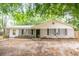 Charming brick home with well-manicured landscaping, black shutters, and a welcoming front entrance at 9887 Midview Dr, Ladson, SC 29456