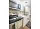 Functional kitchen featuring stainless steel appliances, including an oven, microwave, and sink at 9887 Midview Dr, Ladson, SC 29456