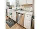 Well-maintained kitchen with stainless steel dishwasher, sink, and ample counter space at 9887 Midview Dr, Ladson, SC 29456