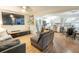 Inviting living room with comfortable seating, a TV, and an open layout connected to the kitchen at 9887 Midview Dr, Ladson, SC 29456