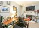 Comfortable living room with a fireplace and office area at 9887 Midview Dr, Ladson, SC 29456