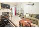 Comfortable living room featuring a cozy fireplace and a collection of fishing rods against the wall at 9887 Midview Dr, Ladson, SC 29456