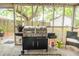 Covered porch featuring a modern grill and comfortable seating, perfect for outdoor cooking and relaxation at 9887 Midview Dr, Ladson, SC 29456