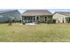 A well-maintained backyard featuring a patio and lush green lawn, perfect for outdoor entertaining and relaxation at 1011 Old Field Dr, Summerville, SC 29483