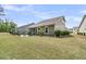 Beautiful home showcasing a large yard, patio, and lush landscaping, perfect for outdoor living at 1011 Old Field Dr, Summerville, SC 29483