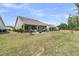 Expansive backyard with a screened porch, showcasing ample space for outdoor activities and a serene, private setting at 1011 Old Field Dr, Summerville, SC 29483