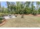 Expansive backyard featuring a patio with a built-in grill, perfect for outdoor gatherings at 1011 Old Field Dr, Summerville, SC 29483