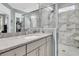 Bright bathroom featuring a glass enclosed shower and granite countertop vanity at 1011 Old Field Dr, Summerville, SC 29483