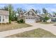 View of a well-maintained home with a two-car garage, showcasing the neatly kept lawn and neighborhood setting at 1011 Old Field Dr, Summerville, SC 29483