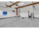 Spacious garage featuring epoxy flooring, high ceilings, and ample storage space for vehicles and equipment at 1011 Old Field Dr, Summerville, SC 29483