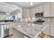 Contemporary kitchen with granite countertops, stainless steel appliances, and light wood floors for a modern feel at 1011 Old Field Dr, Summerville, SC 29483