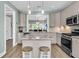 Open kitchen layout with an island, modern appliances, and seamless flow to the living area for easy entertaining at 1011 Old Field Dr, Summerville, SC 29483