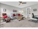 Comfortable living room with neutral tones, ceiling fan, and view to ensuite bathroom at 1011 Old Field Dr, Summerville, SC 29483