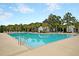 Large community pool with inviting clear water and surrounding lounge chairs offers a relaxing outdoor space at 1011 Old Field Dr, Summerville, SC 29483