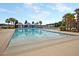 Large swimming pool with lounge chairs, cabanas and palm trees, perfect for relaxation at 1011 Old Field Dr, Summerville, SC 29483