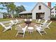 Outdoor recreation area with Adirondack chairs around a fire pit, set on a brick patio at 1011 Old Field Dr, Summerville, SC 29483
