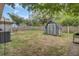 Fenced backyard featuring a shed and an outdoor air conditioning unit, providing both storage and climate control at 1019 Tj Ln, Summerville, SC 29486