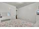 Bright bedroom with a desk, TV, and a cozy floral patterned quilt at 1019 Tj Ln, Summerville, SC 29486