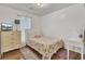 Comfortable bedroom with wood floors, a colorful quilt, and natural light at 1019 Tj Ln, Summerville, SC 29486