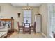 Comfortable dining area with a round table, chairs, and a view to the living room at 1019 Tj Ln, Summerville, SC 29486