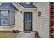 Close-up of the front door, showing its decorative details and inviting entryway at 1019 Tj Ln, Summerville, SC 29486