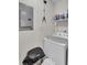 Laundry room features white washing machine and utility shelves at 1019 Tj Ln, Summerville, SC 29486