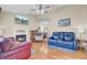 Inviting living room with a fireplace, ceiling fan, and hardwood floors at 1019 Tj Ln, Summerville, SC 29486