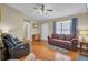 Spacious living room with hardwood floors, comfortable seating, and a large window at 1019 Tj Ln, Summerville, SC 29486