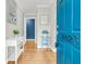 Inviting entryway features hardwood floors, a blue front door, and stylish decor at 1023 Shelley Rd, Charleston, SC 29407