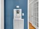 Hallway with decorative niche featuring a blue accent wall, white trim and millwork at 1023 Shelley Rd, Charleston, SC 29407