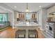 Bright kitchen with a marble island, stainless steel appliances, and tile flooring at 1023 Shelley Rd, Charleston, SC 29407